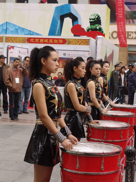 Drummer girls at the launch ceremony of the national tourism action plan in Wangfujing Street, Beijing, April 11, 2009. 