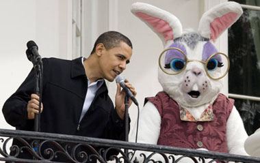 U.S. President Barack Obama looks for a microphone that works while on the Truman Balcony of the White House before the start of the 2009 Easter Egg Roll on the South Lawn in Washington April 13, 2009. [Xinhua/Reuters]