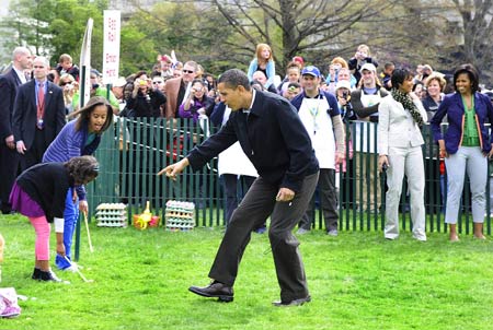 U.S. President Barack Obama and first laday Michelle Obama (1st, R) frist daughters Malia Obama (2st, L) and Sasha Obama (1st, L) attend the Easter Egg Roll at the White House on April 13, 2009. 