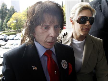 Music producer Phil Spector and wife Rachelle arrive at the criminal courts building in Los Angeles April 13, 2009.
