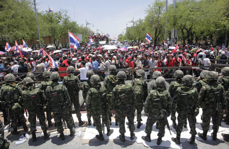 Thai Prime Minister Abhisit Vejjajiva said on Tuesday afternoon the tension caused by anti-government protesters has been eased, and the retreat of the red-shirted people does not mean a victory or loss of any side, but a victory of society, since normalcy has returned.