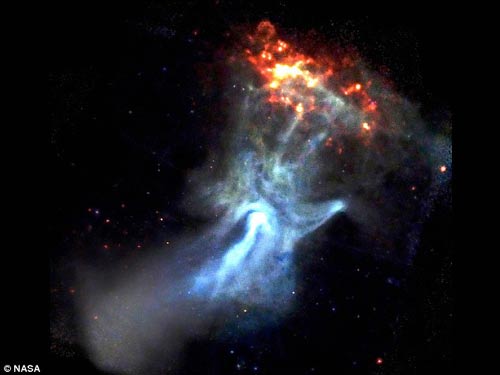 A photo of Pulsar B1509 taken by NASA's Chandra X-ray observatory. It looks like a hand of God reaching out into the cosmos, but NASA says the display is caused by a young and powerful pulsar.[NASA]