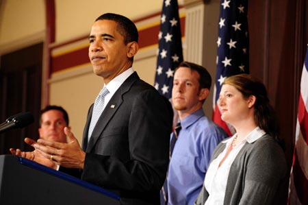 U.S. President Barack Obama speaks about restoring fairness to the tax code and providing tax relief to working families, as representatives of working family stand behind him, at Eisenhower Executive Office Building in Washington April 15, 2009.[Xinhua]