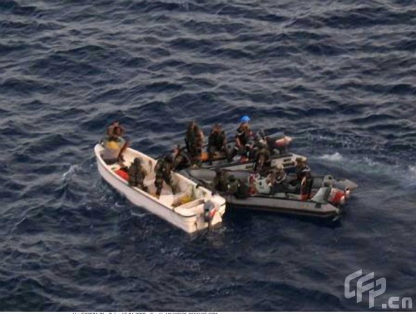 Forces from France's ship Nivose intercept Somali pirates April 15, 2009, in this picture released by the French Ministry of Defence. A French warship has captured 11 pirates off the coast of Kenya, amid calls for the international community to deal with the problem of piracy. The pirates were captured by a warship from an EU piracy patrol, French officials said, hours after a failed attack on a US ship. [ChinaFotoPress/CFP] 