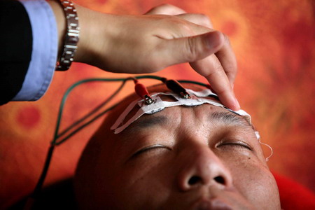 A patient goes through a regular health test inside a compulsory rehabilitation center in Beijing, April 13, 2009. The Tiantanghe rehab center, inside which patients are asked to live in quarantine, opened to the public for the first time this week. [CFP]