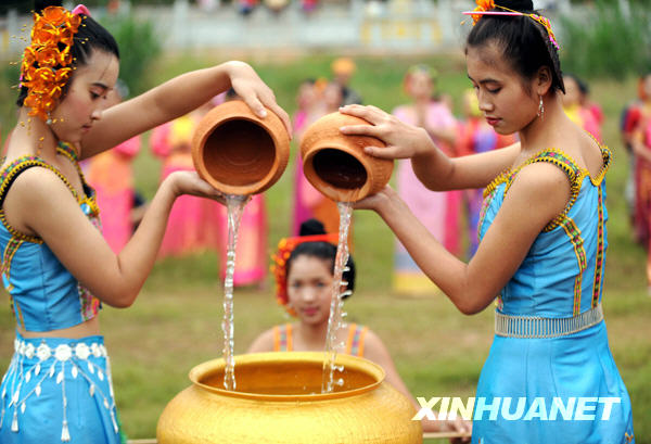 Water from the Lancang River is poured in a special basin during a ceremony.[Xinhua]
