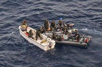 A picture released by the French Army shows French soldiers intercepting pirates off the coast of Kenya. [ECPAD/AFP] 