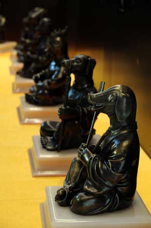 Animal-head-human-body sculptures constructed with ancient technique to mimic the sculptures of the Yuanmingyuan Imperial Summer Palace are shown during an exhibition in Guangzhou, capital of south China's Guangdong Province, April 16, 2009. 