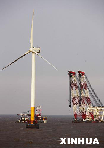 Photo taken on April 1, 2009 shows one of the three 92-meter-high turbines standing just a few kilometers from the Shanghai East China Sea Bridge. The remaining 31 turbines will be constructed in the near future.
