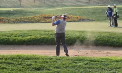 Sand flies, but Monty holed this bunker shot for a birdie on 18. 