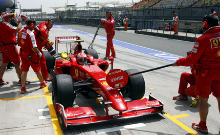 Ferrari driver Kimi Raikkonen of Finland practises a pit stop during the first free practice session of the Chinese Formula One Grand Prix at the Shanghai International circuit, in Shanghai, east China, on April 17, 2009. Raikkonen clocked the 11th fastest time of 1:38.223 in the first session.