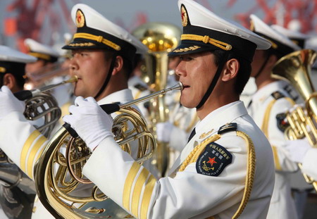 Chinese military band plays to welcome the arrival of a Mexican military ship at the Qingdao port in east China's Shandong province, April 18, 2009.