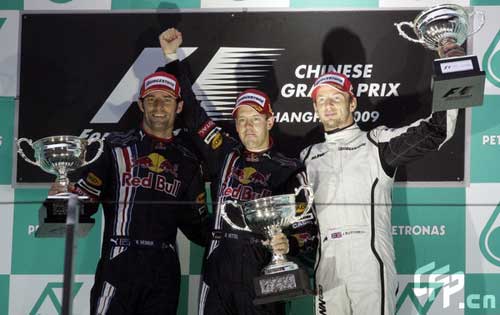 Red Bull driver Sebastian Vettel (C) of Germany, Australian Mark Webber (L) and Brawn GP's Jenson Button celebtate at the victory ceremony of the Chinese F1 Grand Prix in Shanghai, east China, April 19, 2009. [CFP]