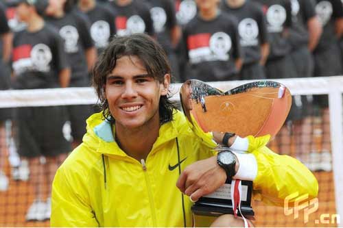 Rafael Nadal of Spain poses with his trophy after dating Novak Djokovic of Serbia in the final match of the Monte Carlo Tennis Masters tournament in Monaco, Sunday, April 19, 2009. 