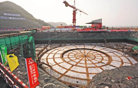 Photo taken on April 18, 2009 shows the foundational construction site of the No.1 unit of the first phase of the Sanmen nuclear plant in Zhejiang Province. The Sanmen nuclear plant, with the world's first nuclear plant using the AP1000 technologies, a type of third generation nuclear power reactor introduced by America's Westinghouse company, started the construction recently. [Tan Jin/Xinhua]