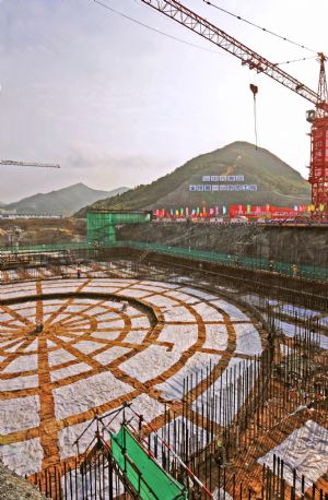 Photo taken on April 18, 2009 shows the foundational construction site of the No.1 unit of the first phase of the Sanmen nuclear plant in Zhejiang Province. The Sanmen nuclear plant, with the world's first nuclear plant using the AP1000 technologies, a type of third generation nuclear power reactor introduced by America's Westinghouse company, started the construction recently. [Tan Jin/Xinhua]