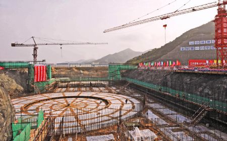 Photo taken on April 18, 2009 shows the foundational construction site of the No.1 unit of the first phase of the Sanmen nuclear plant in Zhejiang Province. The Sanmen nuclear plant, with the world's first nuclear plant using the AP1000 technologies, a type of third generation nuclear power reactor introduced by America's Westinghouse company, started the construction recently. [Tan Jin/Xinhua]