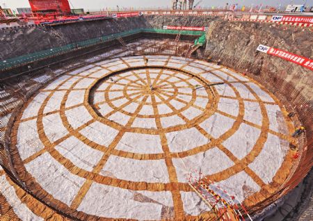 Photo taken on April 18, 2009 shows the foundational construction site of the No.1 unit of the first phase of the Sanmen nuclear plant in Zhejiang Province. The Sanmen nuclear plant, with the world's first nuclear plant using the AP1000 technologies, a type of third generation nuclear power reactor introduced by America's Westinghouse company, started the construction recently. [Tan Jin/Xinhua]