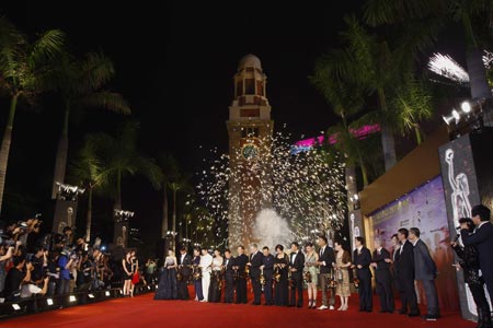 Fireworks explode as actors and actresses take part in a ribbon cutting ceremony of the Hong Kong Film Awards April 19, 2009. [Xinhua/Reuters]