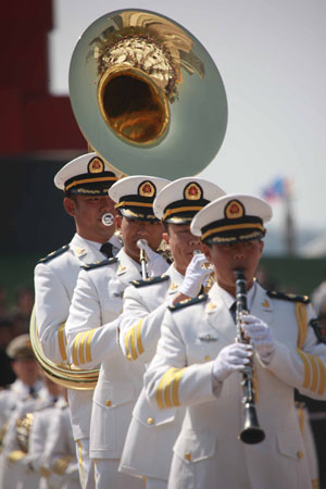 Members of the North China Sea Fleet Military Band of Chinese People's Liberation Army Navy attend a performance in Qingdao, east China's Shandong Province, April 21, 2009. [Li Gang/Xinhua]