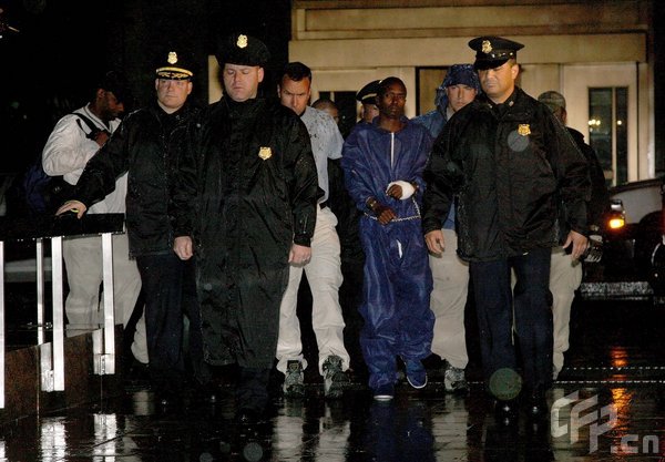 Abduhl Wali-i-Musi (R) who allegedly is involved in the hostage-taking of U.S. commercial ship captain Richard Phillips, is led into Federal Plaza by Federal agents April 20, 2009 in New York City. 