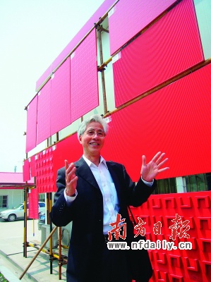 Prof. He Jingtang standing in front of the China Pavilion