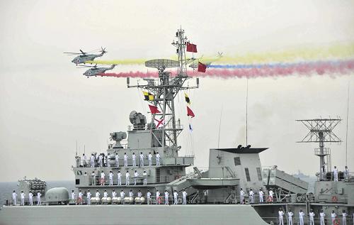 A naval parade of the Chinese People's Liberation Army (PLA) Navy warships and aircraft is held in waters off China's port city of Qingdao, east China's Shandong Province, on April 23, 2009. [Li Gang/Xinhua]