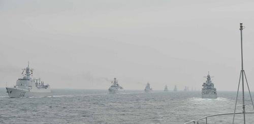 A naval parade of the Chinese People's Liberation Army (PLA) Navy warships and aircraft is held in waters off China's port city of Qingdao, east China's Shandong Province, on April 23, 2009. [Li Gang/Xinhua]