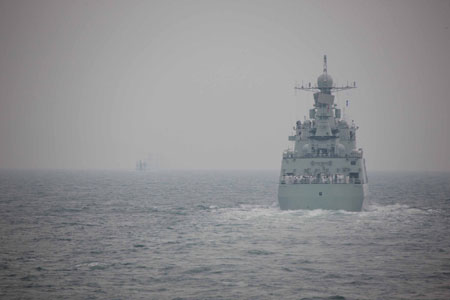 A naval parade of the Chinese People's Liberation Army (PLA) Navy warships and aircraft is held in waters off China's port city of Qingdao, east China's Shandong Province, on April 23, 2009. [Li Gang/Xinhua]