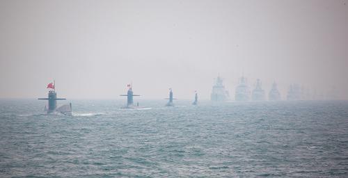 A naval parade of the Chinese People's Liberation Army (PLA) Navy warships and aircraft is held in waters off China's port city of Qingdao, east China's Shandong Province, on April 23, 2009. [Li Gang/Xinhua]