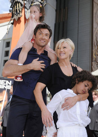 Hugh Jackman (2nd left) poses for photographers with (L-R) daughter Ava, wife Deborra-Lee Furness and son Oscar during a ceremony where the actor places his hand and foot prints in cement in front of the Grauman's Chinese Theatre in Hollywood April 21, 2009. 