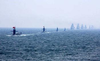 A naval parade of the Chinese People's Liberation Army Navy warships is held in waters off Qingdao, east China's Shandong Province, on April 23, 2009. The parade displayed 25 naval vessels and 31 aircraft of the PLA Navy, including two nuclear submarines, as part of a celebration to mark the 60th anniversary of the founding of the PLA Navy. [Zha Chunming/Xinhua] 