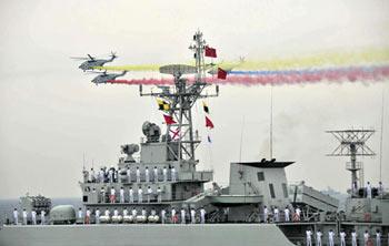 A naval parade of the Chinese People's Liberation Army (PLA) Navy warships and aircraft is held in waters off China's port city of Qingdao, east China's Shandong Province, on April 23, 2009. [Li Gang/Xinhua] 