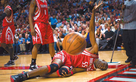 Houston Rockets' Dikembe Mutombo lies injured in the first half of their NBA playoff game against the Portland Trail Blazers in Portland on Tuesday.