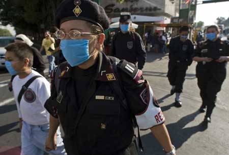  Medical team members wear masks as they walk in downtown Mexico City, capital of Mexico, April 25, 2009. 