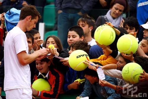 Andy Murray of Great Britain signs autographs for fans after his charity match with Simone Bolelli of Italy in memory of Federico Luzzi of Italy who died of leukemia last year during previews for the Foro Italico Tennis Masters on April 26, 2009 in Rome, Italy. 