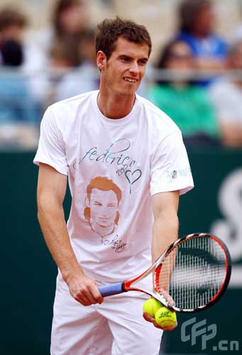 Andy Murray of Great Britain serves to Simone Bolelli of Italy during a charity match in memory of Federico Luzzi of Italy who died of leukemia last year during previews for the Foro Italico Tennis Masters on April 26, 2009 in Rome, Italy.