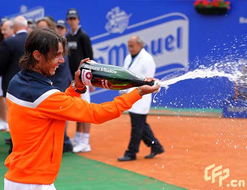 Rafael Nadal of Spain sprays with Cava after his match against his fellow countryman David Ferrer on day seven of the ATP 500 World Tour Barcelona Open Banco Sabadell 2009 tennis tournament at the Real Club de Tenis on April 26, 2009 in Barcelona, Spain. Nadal won the match in two sets, 6-2 and 7-5. 