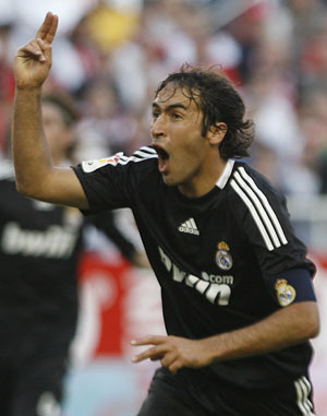 Real Madrid's Raul Gonzalez from Spain reacts after scoring during La Liga soccer match against Sevilla at the Ramon Sanchez Pizjuan stadium in Sevilla, Sunday, April 26, 2009.