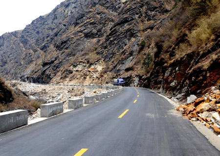 A truck runs on the Lhasa-Kathmandu Highway in southwest China's Tibet Autonomous Region, April 7, 2009. 