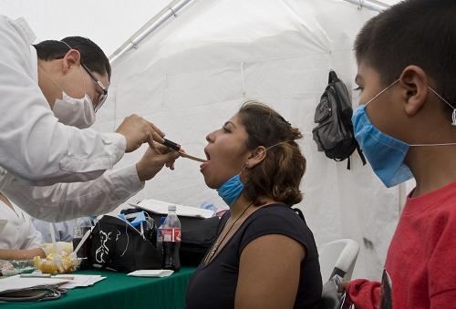 Medical service stations are built on the streets of Mexico City to provide free physical check for people to prevent the spread of swine flu. 