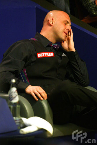 Mark King of England sits in despair in his game against Stephen Maguire of Scotland during the 2nd Round of the Betfred World Snooker Championships at the Crucible Theatre on April 27, 2009 in Sheffield, United Kingdom.