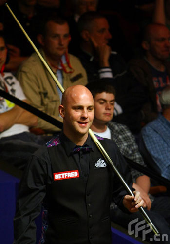 Mark King of England watches his opponent in his game against Stephen Maguire of Scotland during the 2nd Round of the Betfred World Snooker Championships at the Crucible Theatre on April 27, 2009 in Sheffield, United Kingdom.