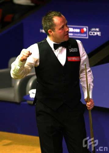 John Higgins of Scotland celebrates winning his match against Jamie Cope during the 2nd Round of the Betfred World Snooker Championships on April 27, 2009 at the Crucible Theatre, Sheffield, in United Kingdom.