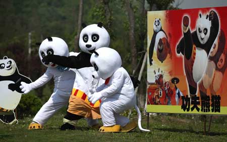 Cartoon panda stars are seen in a scenic spot of Nantong Horticulture Expo Park in Nantong, a city of east China&apos;s Jiangsu Province, April 27, 2009. Bringing many prevailing cartoon stars like panda Paul, Gray Wolf and Happy Sheep to meet visitors, 2009 Nantong Cartoon and Animation Festival was opened in Nantong Horticulture Expo Park on Monday. Activities focusing on eight themes would be held in different scenic spots of the park. [Photo:Xinhua]