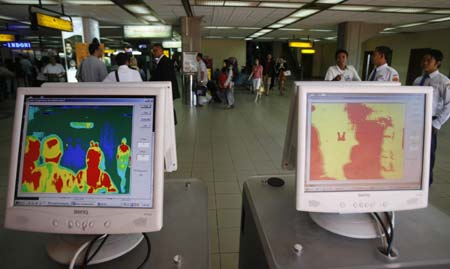 Thermal scanners are installed in the arrival terminal to check the temperature of arriving passengers at Ngurah Rai International Airport in Denpasar in Indonesia's resort island of Bali April 27, 2009. Countries around the world have moved to contain the spread of a possible pandemic after a new swine flu outbreak killed 103 people in Mexico.