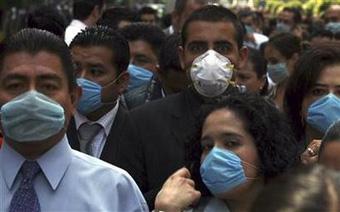 People wear surgical face masks as they gather outside of buildings after earthquake in Mexico City April 27, 2009. [Eliana Aponte/REUTERS]