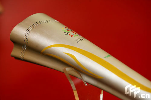 Photo taken on April 28, 2009 shows the torch named 'Ruyi' for China's 11th National Games in Jinan, capital of east China's Shandong Province. Using the image of Chinese traditional ruyi, an s-shaped ornamental object which is usually made of jade and is a symbol of good luck, the torch made a debut in Jinan on Tuesday. 