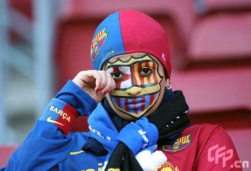 A Barcelona fan shows her support, in the stands prior to kick off.