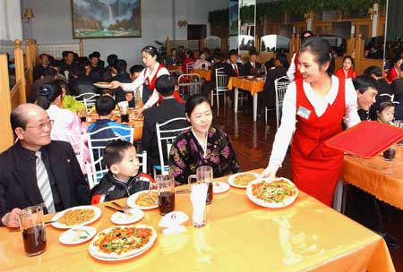 People enjoy their meal at the first Italian restaurant in Pyongyang, capital of the Democratic People's Republic of Korea (DPRK), in this picture released by Korean Central News Agency (KCNA) on April 28, 2009.